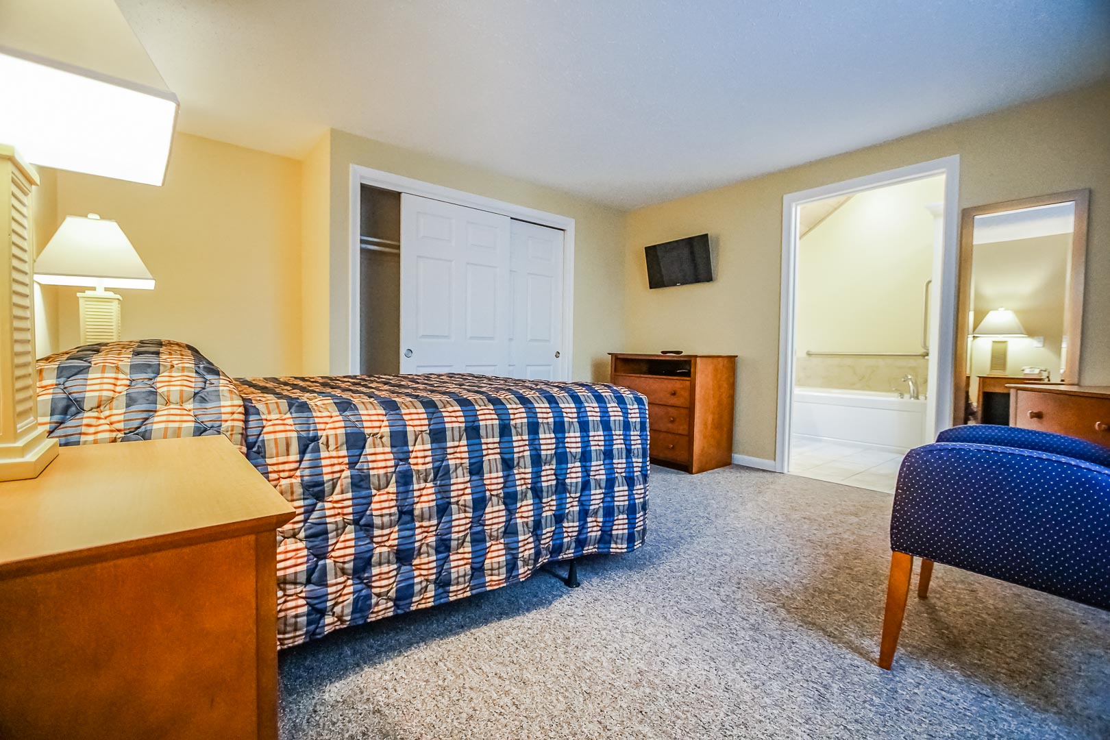 A fully equipped master bedroom at VRI's Cape Cod Holiday Estates in Massachusetts.
